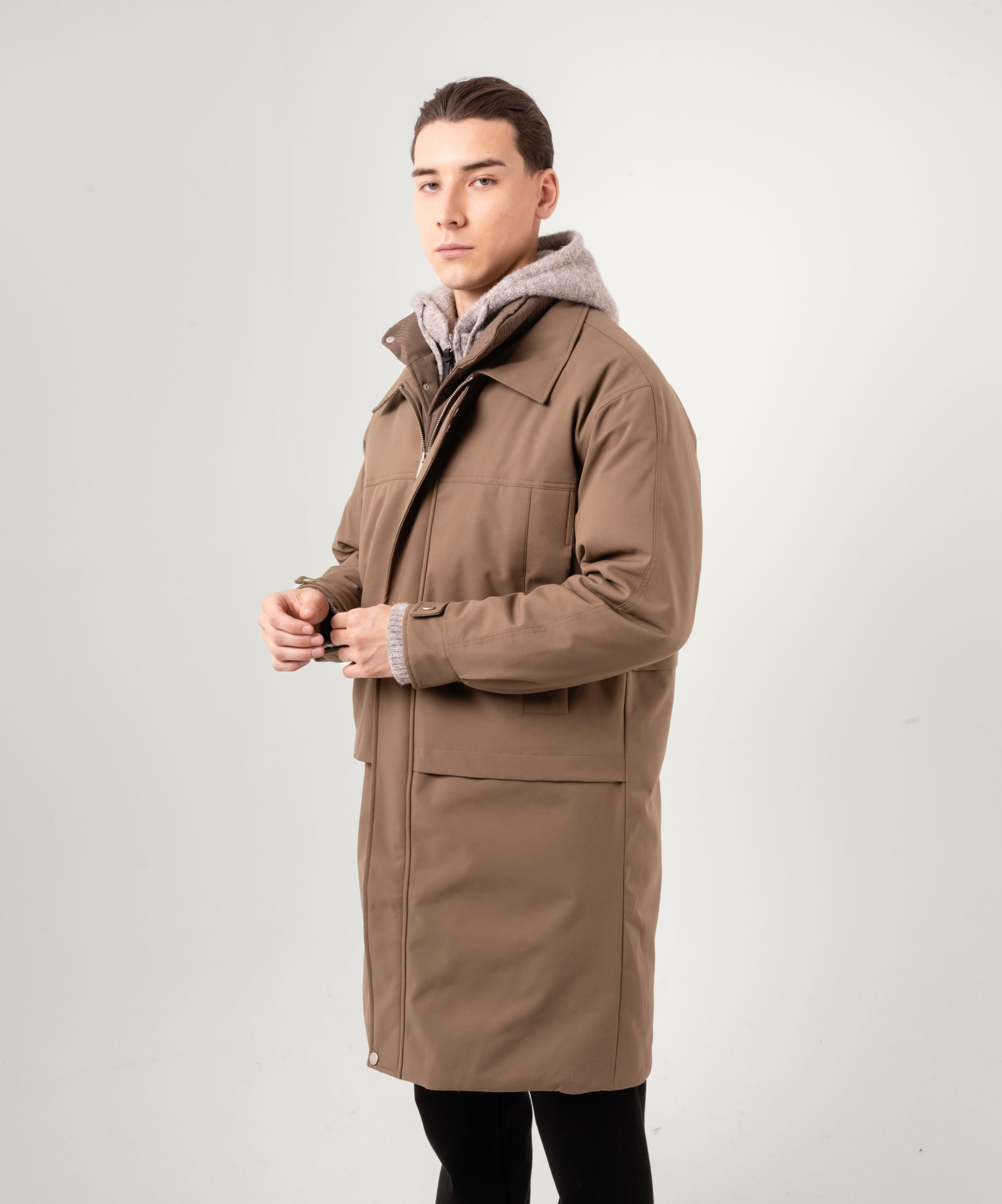 Пуховик средней длины цвета хаки