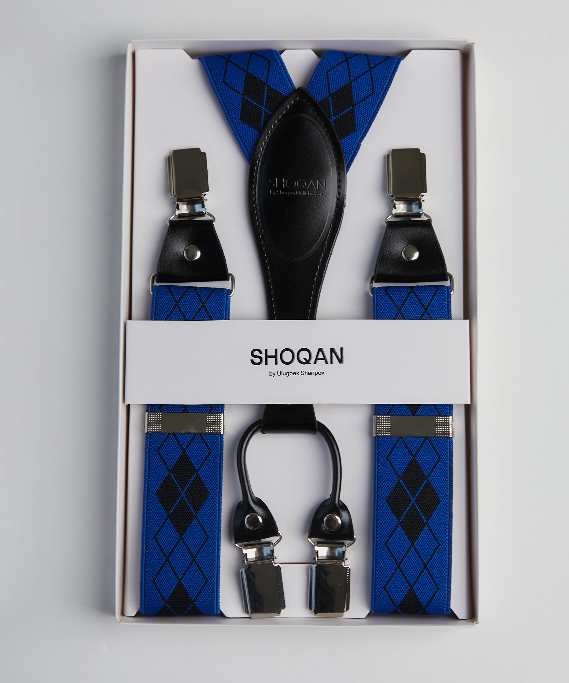 Подтяжки синего цвета с кожаной вставкой